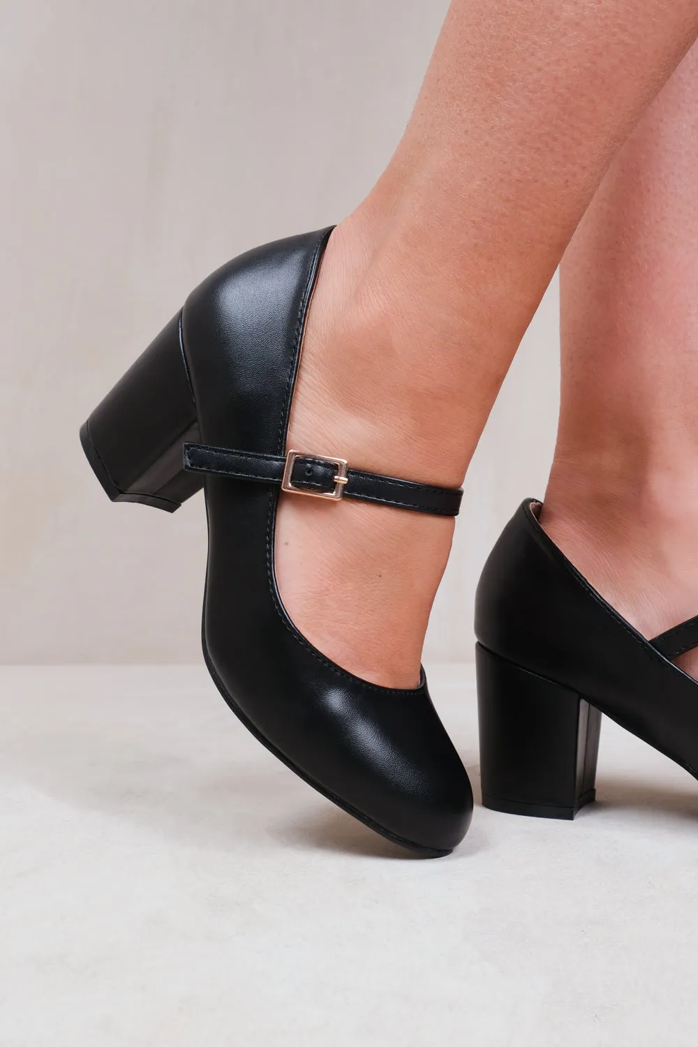 ARACELI WIDE FIT BLOCK HEEL MARY JANE PUMPS IN BLACK FAUX LEATHER